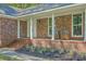 Inviting front porch with stylish seating and brick accents, perfect for relaxing at 169 Southwold Cir, Goose Creek, SC 29445