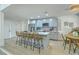 Bright kitchen features an island with bar stool seating, modern appliances and stylish tile backsplash at 169 Southwold Cir, Goose Creek, SC 29445