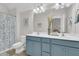 Bathroom featuring double vanity sinks, with a glass shower and tub at 1761 Old Military Rd, Charleston, SC 29412