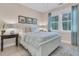 Cozy bedroom with a comfy bed and two windows with natural light at 1761 Old Military Rd, Charleston, SC 29412