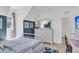 Stylish bedroom featuring a comfortable bed, a dresser, and artwork at 1761 Old Military Rd, Charleston, SC 29412
