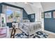 Cozy bedroom features two bright windows and stylish decor at 1761 Old Military Rd, Charleston, SC 29412