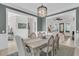 Charming dining room with a farmhouse table, elegant chairs, and seamless access to the living area at 1761 Old Military Rd, Charleston, SC 29412