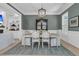 Dining room features stylish chandelier, rug, and built-in shelves, great for gatherings at 1761 Old Military Rd, Charleston, SC 29412