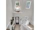 Grand foyer with high ceilings, a modern chandelier, and wood flooring at 1761 Old Military Rd, Charleston, SC 29412