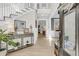 Welcoming foyer featuring hardwood floors, a staircase, and a view into the home's elegant living spaces at 1761 Old Military Rd, Charleston, SC 29412