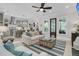 Bright, open living room featuring a ceiling fan, striped rug, and seamless flow into the modern kitchen at 1761 Old Military Rd, Charleston, SC 29412