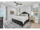 Inviting main bedroom featuring a ceiling fan, stylish furnishings and an accent rug at 1761 Old Military Rd, Charleston, SC 29412