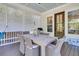 Covered patio with a dining area, ceiling and a beautiful view of the landscaped backyard at 1761 Old Military Rd, Charleston, SC 29412