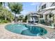 Backyard pool area with mature landscaping, lounge chairs and a perfect setup for outdoor relaxation at 1761 Old Military Rd, Charleston, SC 29412
