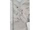 Luxurious shower featuring elegant marble tiling and modern fixtures at 1761 Old Military Rd, Charleston, SC 29412