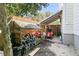 Outdoor storage area with wood pile and lawn equipment providing practical solutions for yard maintenance at 1761 Old Military Rd, Charleston, SC 29412