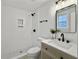 Stylish bathroom featuring a tiled walk-in shower and modern vanity with black accents at 1915 Quitman St, North Charleston, SC 29405