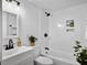 Bathroom featuring a tiled shower and tub, a modern sink, and black hardware at 1915 Quitman St, North Charleston, SC 29405