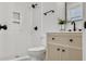 This bathroom features a tiled walk-in shower, black hardware, and a modern vanity at 1915 Quitman St, North Charleston, SC 29405