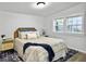 Cozy bedroom with queen bed, natural light, and classic decor at 1915 Quitman St, North Charleston, SC 29405