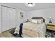 Comfortable bedroom with a queen size bed, stylish rug, and closet at 1915 Quitman St, North Charleston, SC 29405