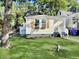 Charming home with wood accents, flower boxes, and green lawn, perfect for curb appeal at 1915 Quitman St, North Charleston, SC 29405