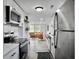 Bright kitchen with stainless steel appliances and open layout to living area at 1915 Quitman St, North Charleston, SC 29405