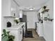 Functional kitchen with white cabinets, stainless steel appliances, and a stylish black rug at 1915 Quitman St, North Charleston, SC 29405