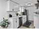 Well-lit kitchen with white cabinets, subway tile backsplash, and stainless steel appliances at 1915 Quitman St, North Charleston, SC 29405