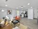 Open-concept living room with neutral tones, flowing into the kitchen for easy entertaining at 1915 Quitman St, North Charleston, SC 29405