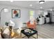 Modern living room leading into a stylish kitchen, perfect for contemporary living at 1915 Quitman St, North Charleston, SC 29405