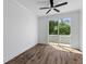 A bedroom featuring wood-look flooring, a ceiling fan and access to a deck at 1989 Groveland Ave, North Charleston, SC 29405