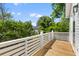 Private outdoor deck space with white railings, overlooking a lush green yard at 1989 Groveland Ave, North Charleston, SC 29405