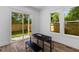 Bright dining area featuring wood floors, a modern table set, and sliding glass doors leading to the backyard at 1989 Groveland Ave, North Charleston, SC 29405
