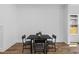 Contemporary dining area with a modern black table set, set beside a window, ideal for intimate meals at 1989 Groveland Ave, North Charleston, SC 29405