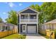 Inviting two-story home with a garage, covered porch and a well-kept front yard at 1989 Groveland Ave, North Charleston, SC 29405