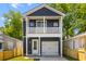 Charming two-story home with a covered porch, garage, and well-manicured front yard at 1989 Groveland Ave, North Charleston, SC 29405