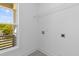 A bright laundry room featuring tile flooring at 1989 Groveland Ave, North Charleston, SC 29405