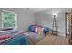 Bright bedroom features hardwood floors, large windows, and twin beds with colorful Hot Wheels themed bedding at 200 Commencement Blvd, Ladson, SC 29456