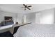 Bright bedroom with ceiling fan is complemented by a cozy rug and hardwood floors at 200 Commencement Blvd, Ladson, SC 29456