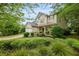 Well-maintained two-story home with a two-car garage, lush landscaping, and a welcoming front porch at 200 Commencement Blvd, Ladson, SC 29456