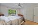 Bright bedroom featuring a ceiling fan, a closet, and a sliding door at 2011 N Highway 17 # 1400P, Mount Pleasant, SC 29466
