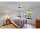 Cozy bedroom featuring a window with backyard views and a ceiling fan at 2011 N Highway 17 # 1400P, Mount Pleasant, SC 29466