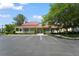 Community clubhouse featuring a red roof, welcoming porch, and ample parking at 2011 N Highway 17 # 1400P, Mount Pleasant, SC 29466