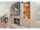 Stone fireplace surrounded by built-in bookshelves, showcasing the room's cozy design at 2011 N Highway 17 # 1400P, Mount Pleasant, SC 29466