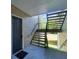 A view of the front door and exterior staircase leading to the unit, complemented by a welcome mat at 2011 N Highway 17 # 1400P, Mount Pleasant, SC 29466