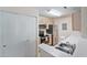 Well-equipped kitchen features stainless steel appliances, light wood cabinets, and ample storage with closet doors at 2011 N Highway 17 # 1400P, Mount Pleasant, SC 29466