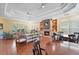 The community's large, inviting living room with comfortable seating, tables, and a fireplace at 2011 N Highway 17 # 1400P, Mount Pleasant, SC 29466