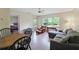 Bright living room features a comfortable gray sectional couch, leather chair, and a view of the outdoors at 2011 N Highway 17 # 1400P, Mount Pleasant, SC 29466