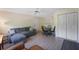 Cozy living area with a sectional couch, dining table, and white closet doors, offering a comfortable living space at 2011 N Highway 17 # 1400P, Mount Pleasant, SC 29466