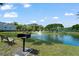 Community pond view with bench, grill, and fountain, near a tennis court and playground at 2011 N Highway 17 # 1400P, Mount Pleasant, SC 29466