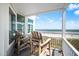 Balcony with seating overlooking the ocean and beach at 216 W Arctic Ave # 9, Folly Beach, SC 29439