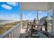 Balcony seating area with beautiful views of the beach and ocean at 216 W Arctic Ave # 9, Folly Beach, SC 29439