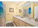 Clean bathroom featuring double sinks, large mirror, and bathtub with shower at 216 W Arctic Ave # 9, Folly Beach, SC 29439